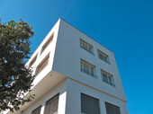 The striking overhang emphasizes the boundary between old and new