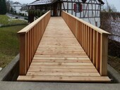 The wooden bridge provides direct access to the museum rooms