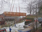 A crane lifted the 10.5 meter long bridge into place